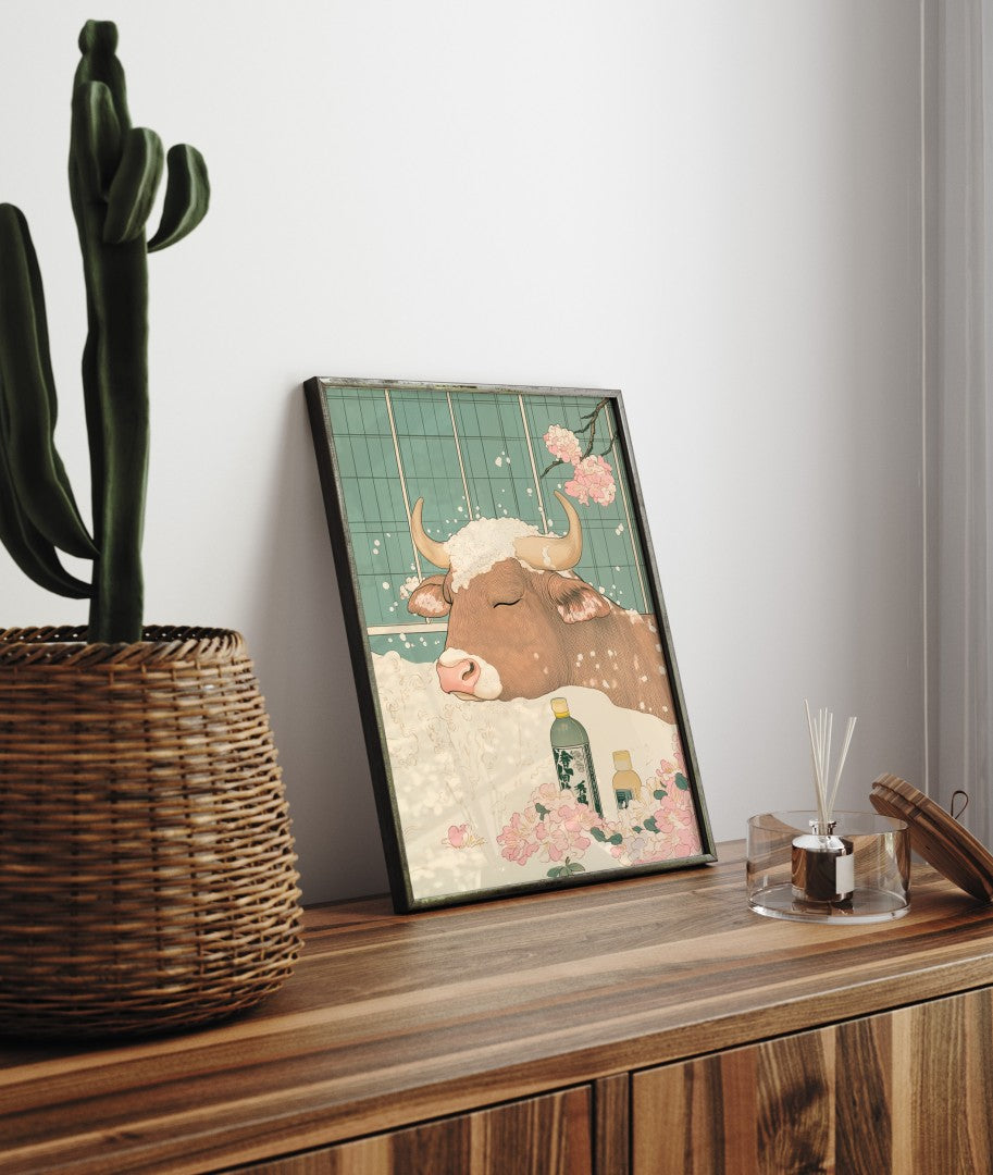 Framed bathroom decor showing a gentle cow in a Japanese-style flower bath