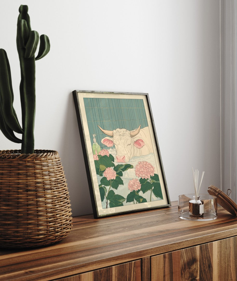 Framed bathroom decor featuring a gentle cow in a flower-filled Japanese-style bath
