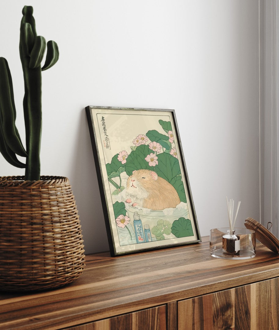 Framed bathroom decor featuring a sweet guinea pig in a flower-filled Japanese bath