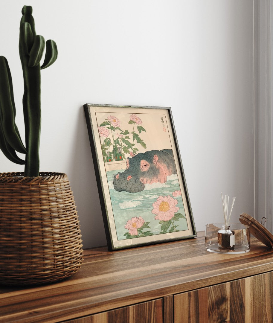 Framed bathroom decor featuring a relaxed hippo in a flower-filled Japanese-style bath