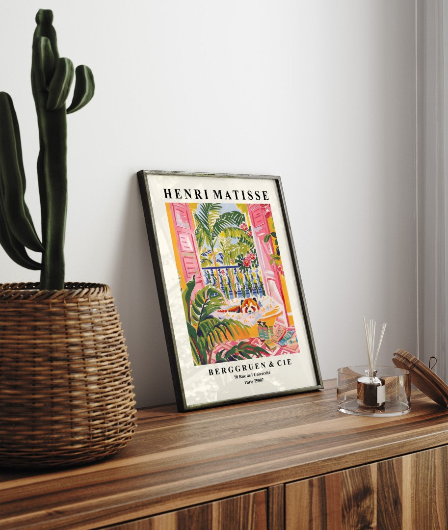 Framed Henri Matisse inspired art print of a red panda relaxing in a yellow bathtub with tropical leaves and flowers - bathroom wall art print for decor