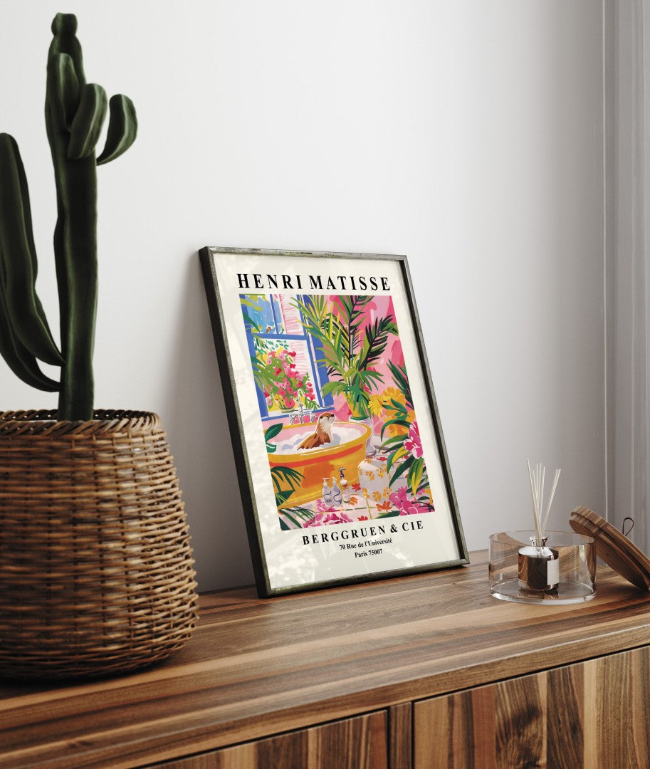 Framed Henri Matisse inspired print showing a playful otter in a lush bath scene.
