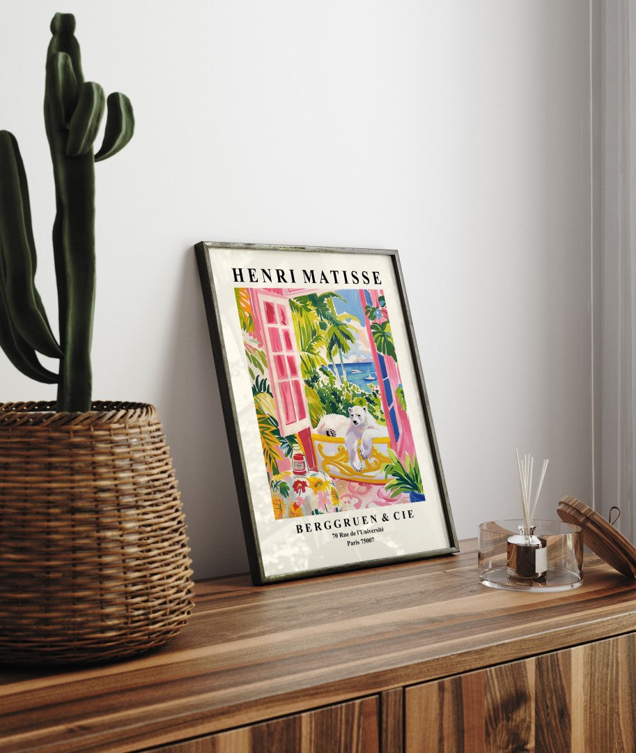 Framed Matisse inspired bathroom print featuring a polar bear, tropical plants, and ocean scenery.