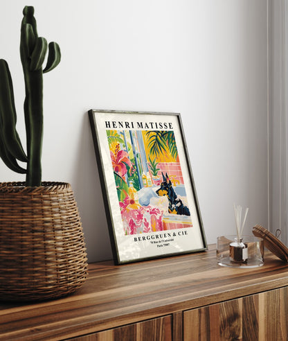 Framed artwork of a Doberman in a bright, plant-filled interior.