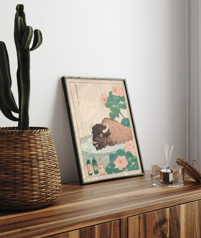 Framed bathroom decor showing a calm bison resting in a floral Japanese bath