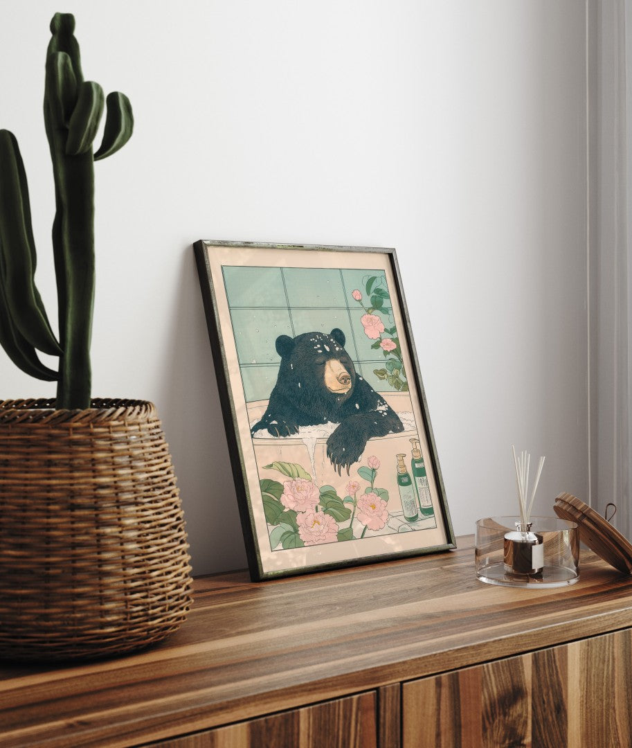 Framed bathroom decor showing a sun bear in a tranquil Japanese-style soak