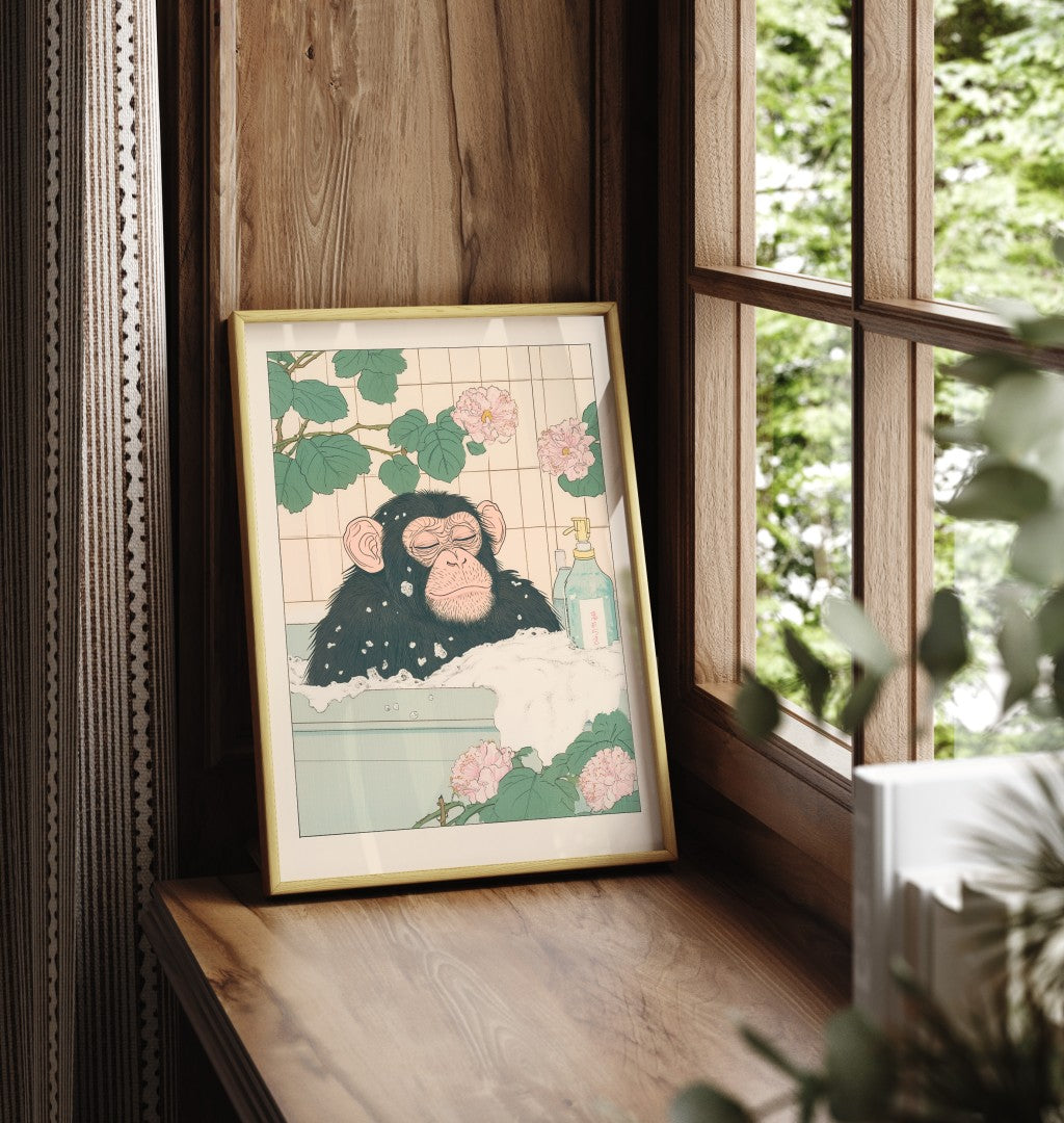 Framed chimpanzee bathroom print with calm expression and botanical background