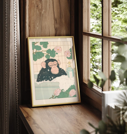 Framed chimpanzee bathroom print with calm expression and botanical background