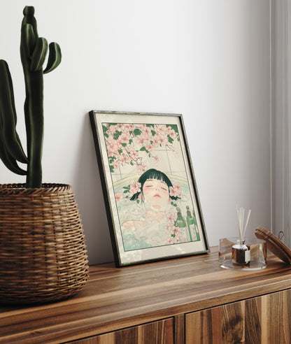 Framed bathroom decor featuring a peaceful woman in a floral Japanese bath