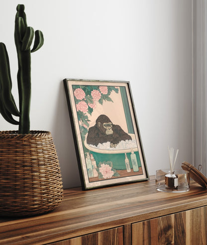 Framed bathroom decor featuring a relaxed gorilla in a Japanese-style flower bath