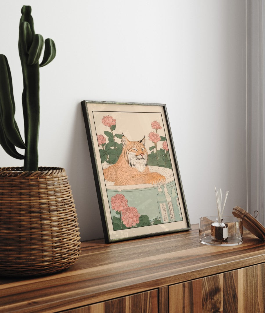 Framed bathroom decor showing a relaxed lynx in a Japanese-style flower bath