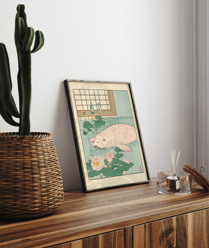 Framed bathroom decor showing a relaxed manatee in a Japanese-style flower soak